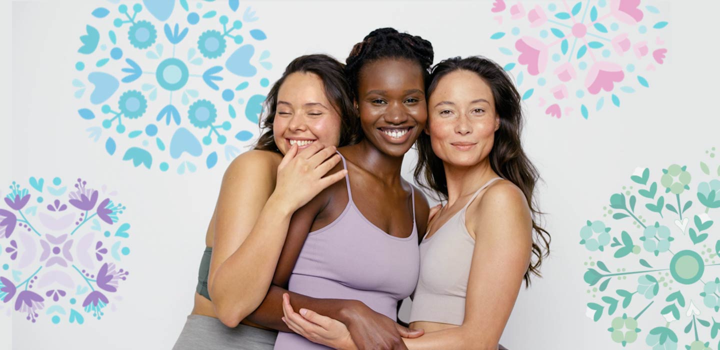 Ženy se společně smějí na barevném pozadí